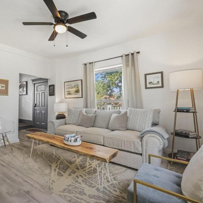 a living room with a couch and a ceiling fan at 5BR Home 10 mins Fair Park, Sleeps 14 in Oklahoma City