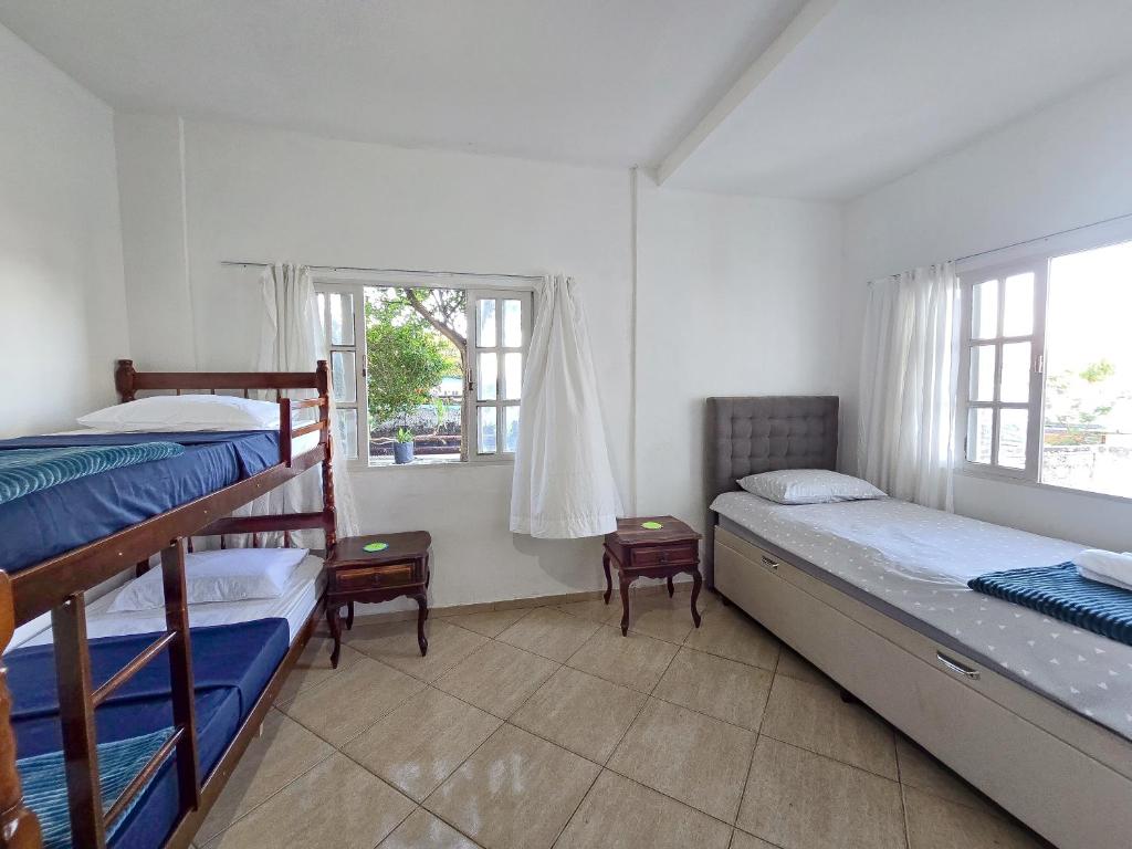 Postel nebo postele na pokoji v ubytování Hostel Chico Lessa
