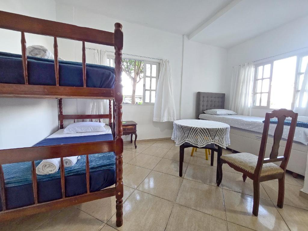 Postel nebo postele na pokoji v ubytování Hostel Chico Lessa