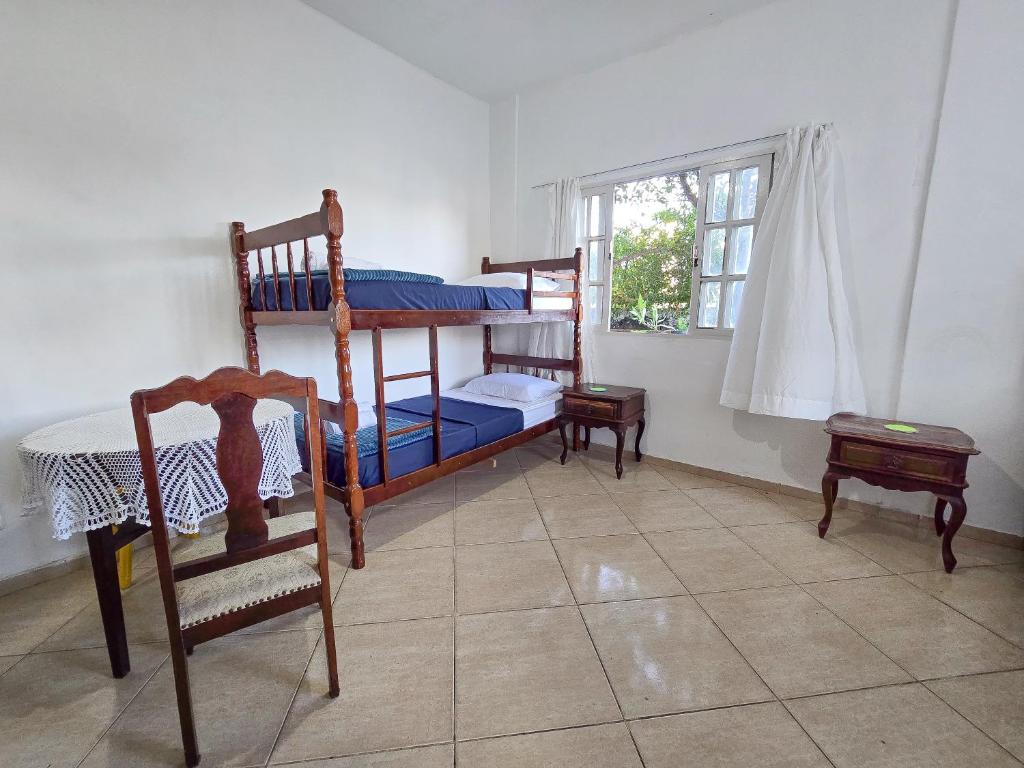 Postel nebo postele na pokoji v ubytování Hostel Chico Lessa
