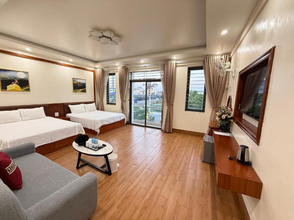 Ένα ή περισσότερα κρεβάτια σε δωμάτιο στο Bảo Châu Hotel