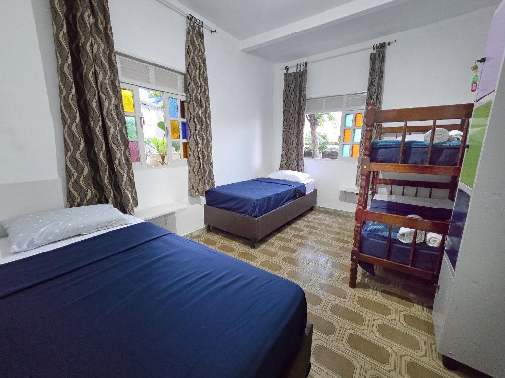Postel nebo postele na pokoji v ubytování Hostel Chico Lessa