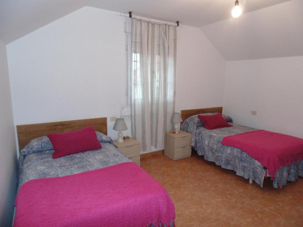 Postel nebo postele na pokoji v ubytování APARTAMENTOS OUTEIRO