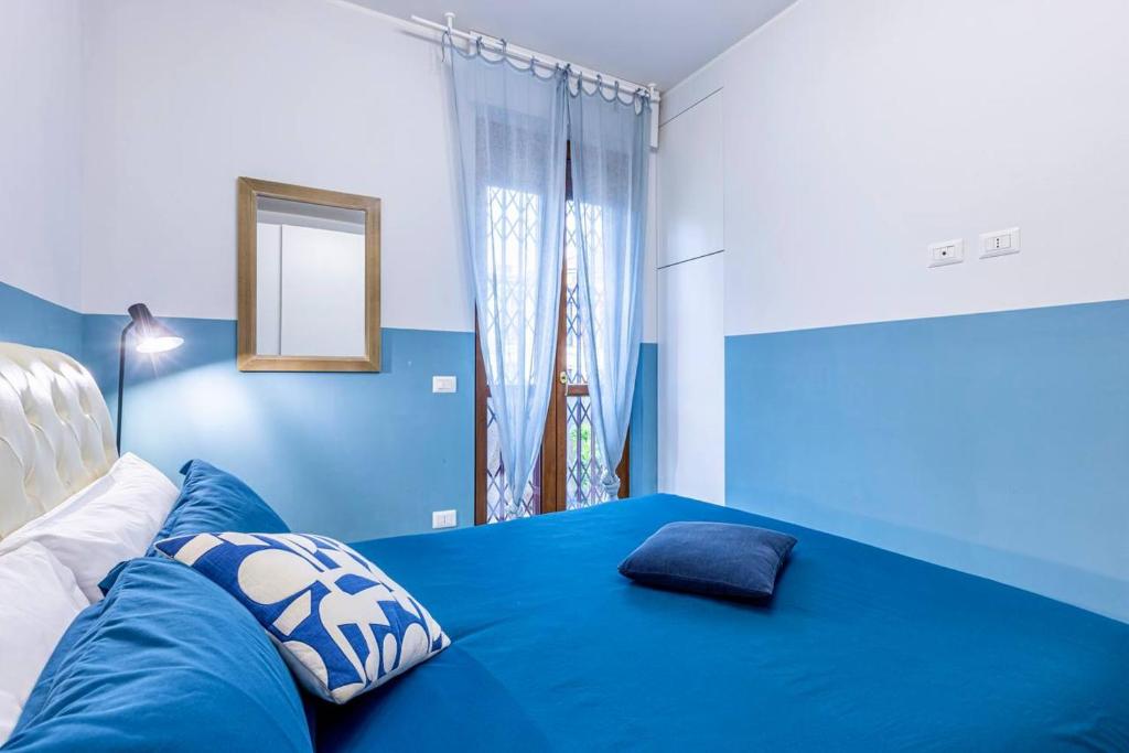 Postel nebo postele na pokoji v ubytování Blue Nest - Stazione Centrale