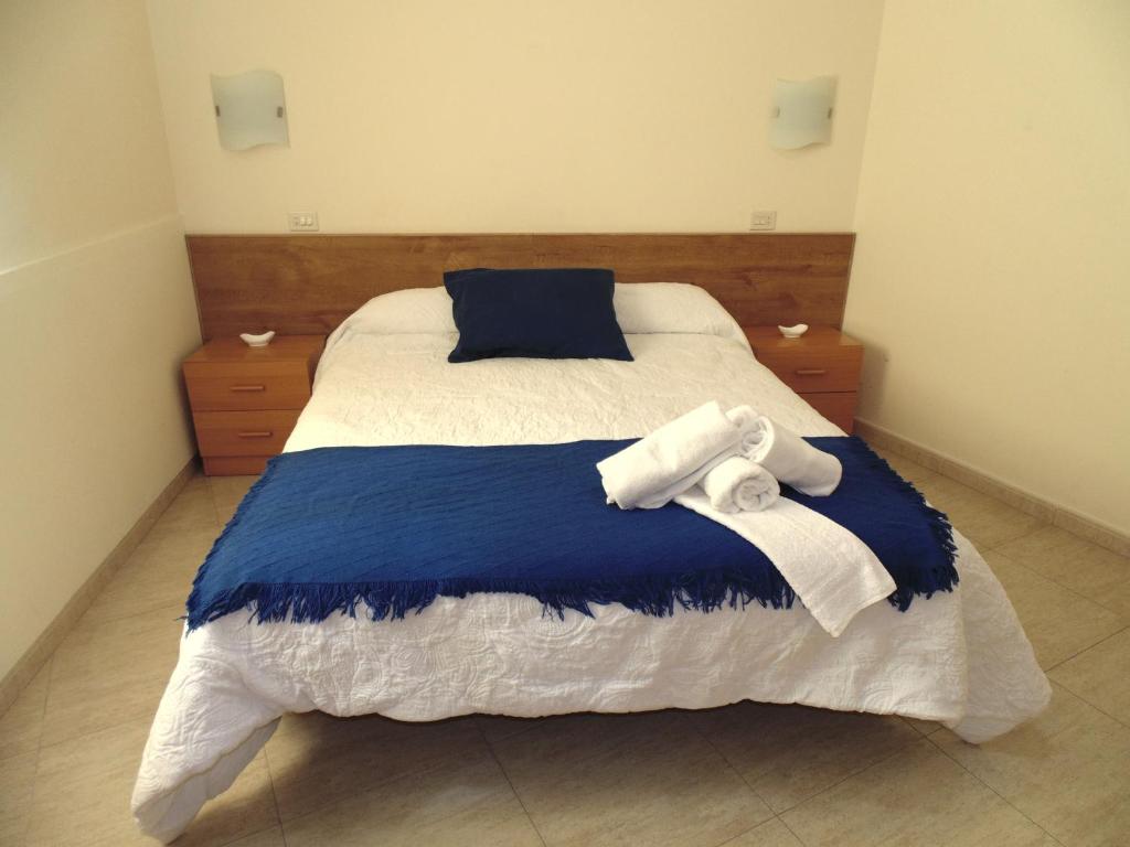 Postel nebo postele na pokoji v ubytování APARTAMENTOS OUTEIRO