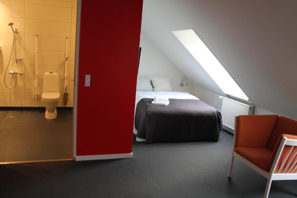 Postel nebo postele na pokoji v ubytování Severin Kursuscenter og Konferencehotel