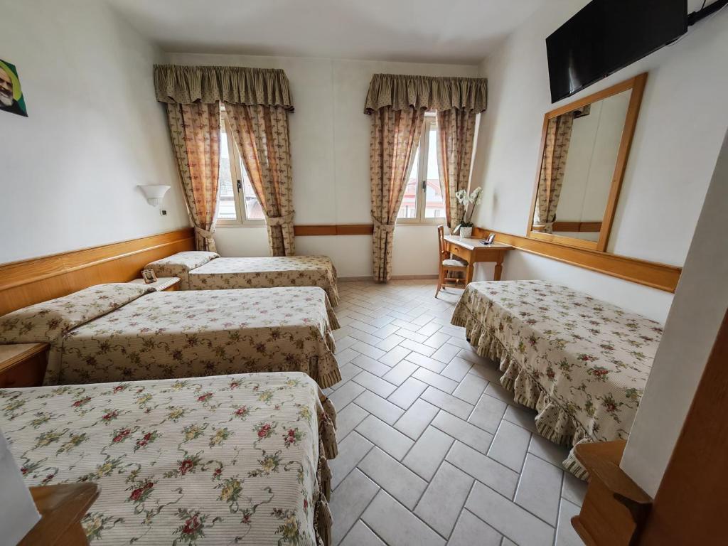 Postel nebo postele na pokoji v ubytování Hotel Pace
