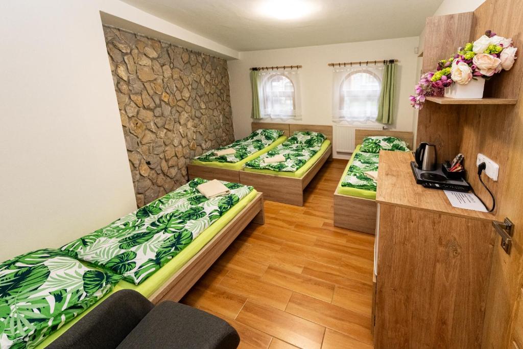 Postel nebo postele na pokoji v ubytování Vinný sklep u Křížů