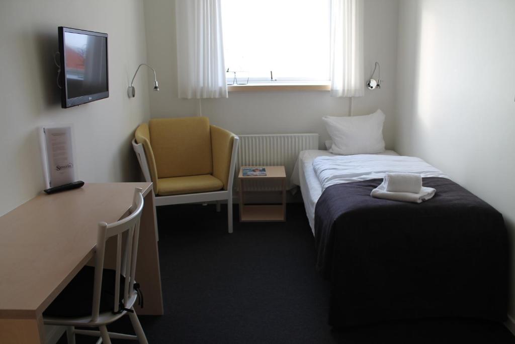 Postel nebo postele na pokoji v ubytování Severin Kursuscenter og Konferencehotel