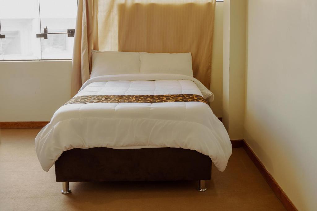 Postel nebo postele na pokoji v ubytování Hotel Casa Shami
