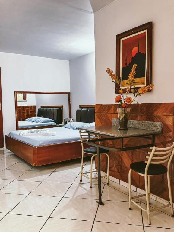 Postel nebo postele na pokoji v ubytování Onix Motel