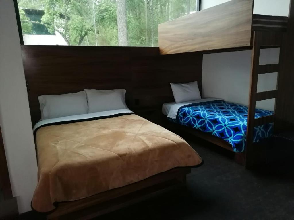 Ένα ή περισσότερα κρεβάτια σε δωμάτιο στο Beautiful cabin in the middle of the forest