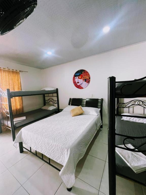 Postel nebo postele na pokoji v ubytování Hotel Zipa Villeta - Sede Tradicional