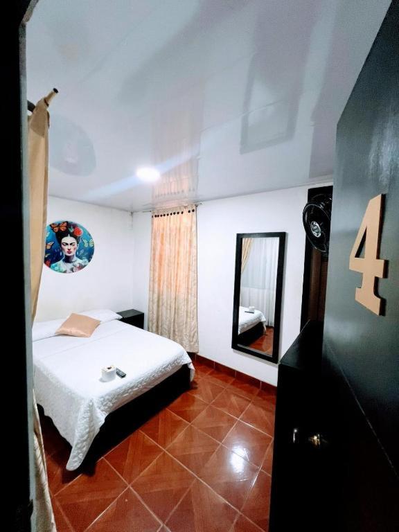 Postel nebo postele na pokoji v ubytování Hotel Zipa Villeta - Sede Tradicional