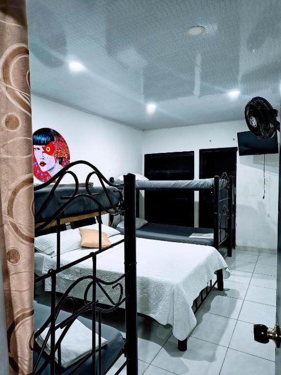 Postel nebo postele na pokoji v ubytování Hotel Zipa Villeta - Sede Tradicional