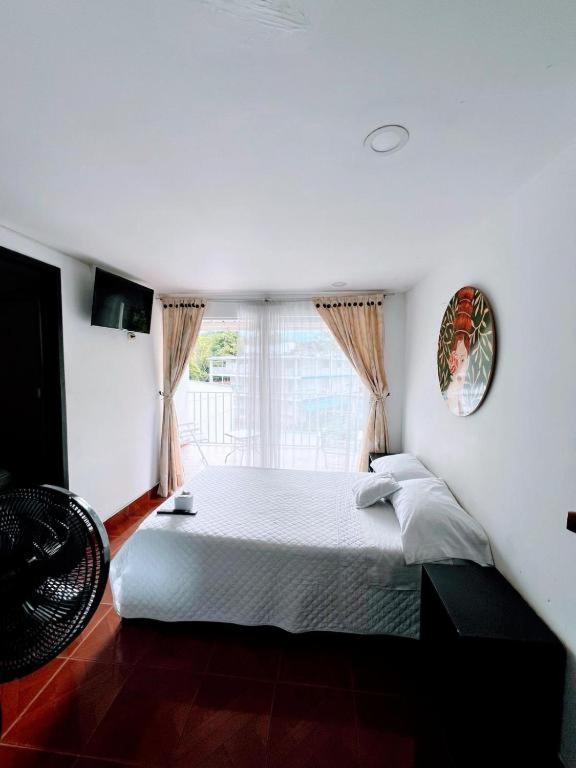 Postel nebo postele na pokoji v ubytování Hotel Zipa Villeta - Sede Tradicional