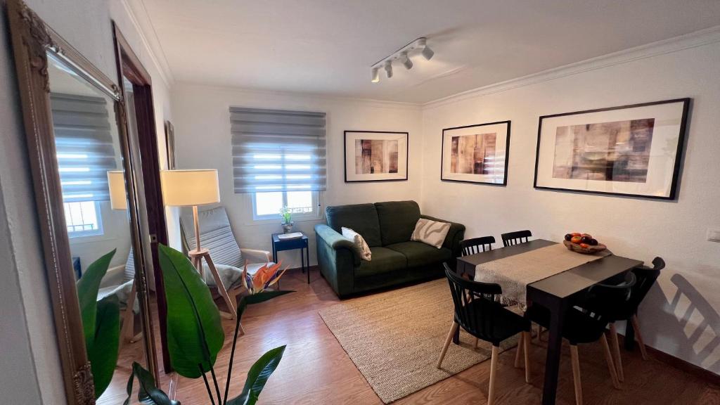 a living room with a couch and a table at Cozy Historical Andalusian 3BR House Peachy Stays in Mijas