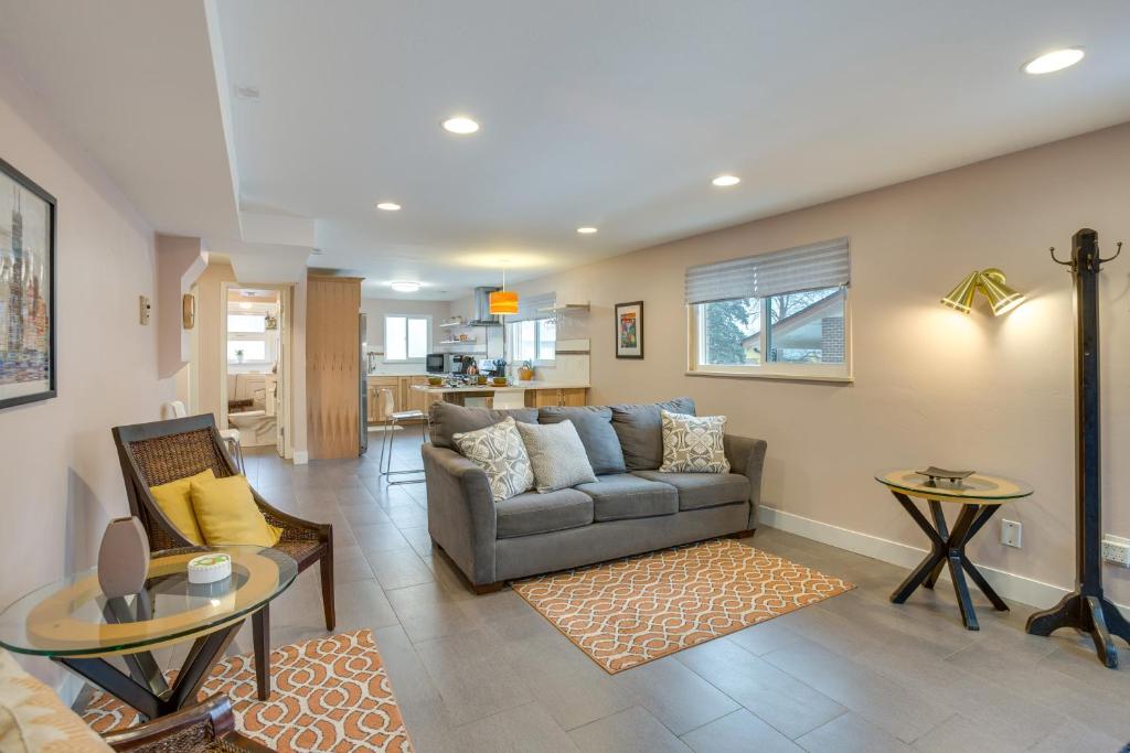a living room with a couch and a table at 9 Mi to Dtwn Quiet South Denver Apartment in Denver