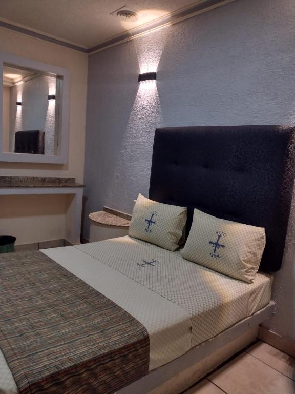 Postel nebo postele na pokoji v ubytování Hotel Astur