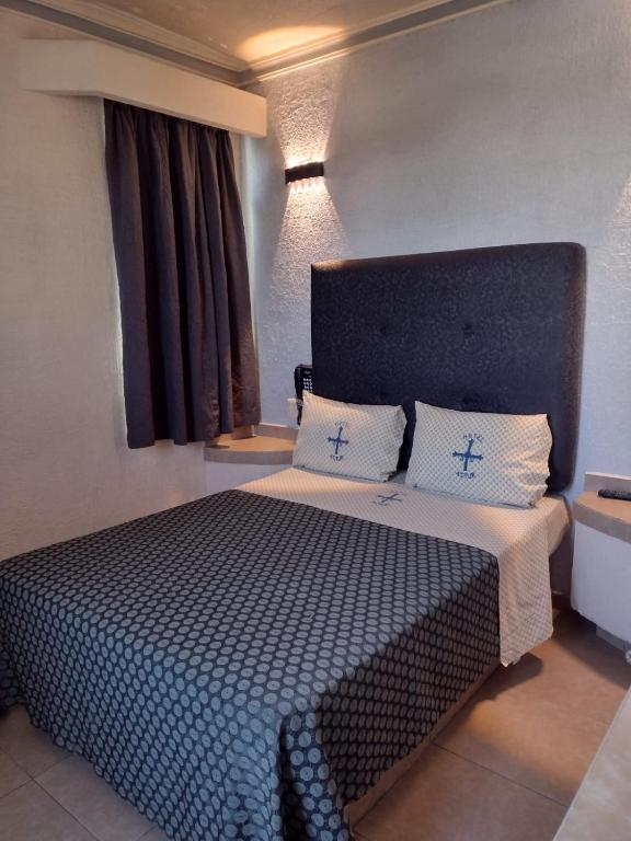 Postel nebo postele na pokoji v ubytování Hotel Astur
