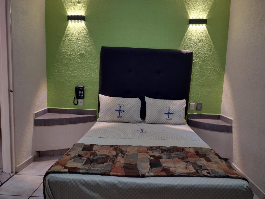 Postel nebo postele na pokoji v ubytování Hotel Astur