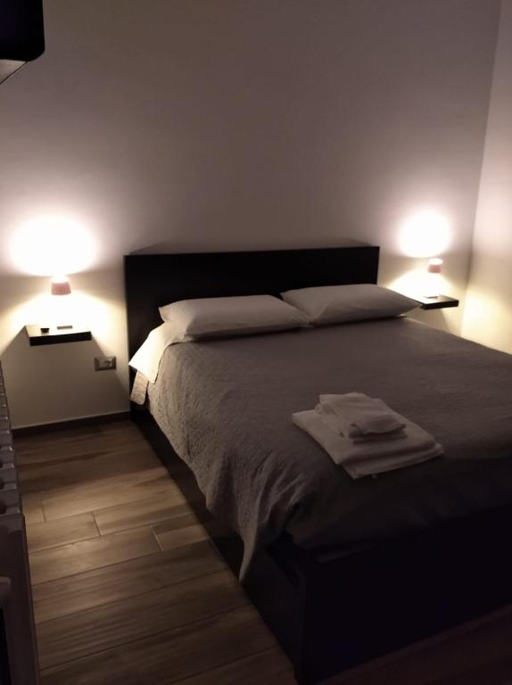 Postel nebo postele na pokoji v ubytování Dimora 85