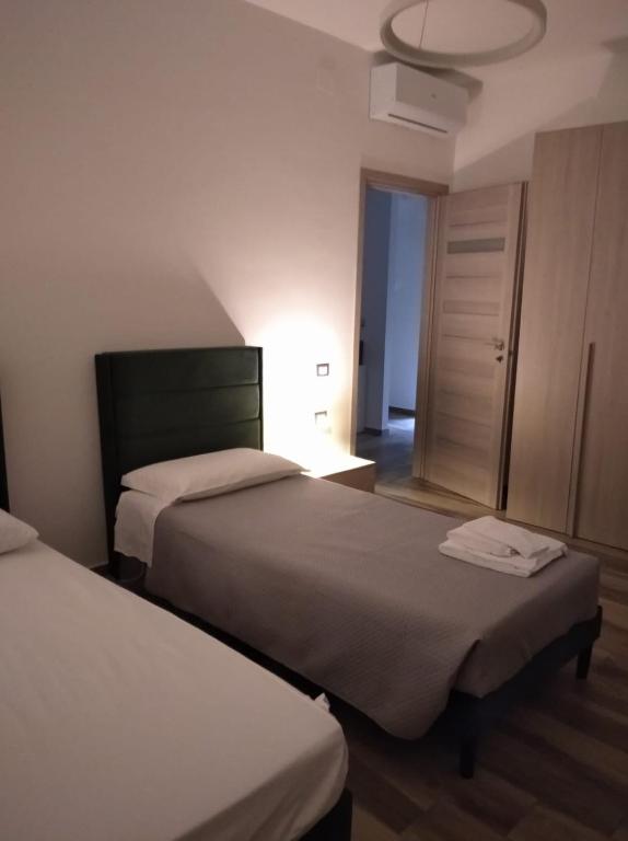Postel nebo postele na pokoji v ubytování Dimora 85