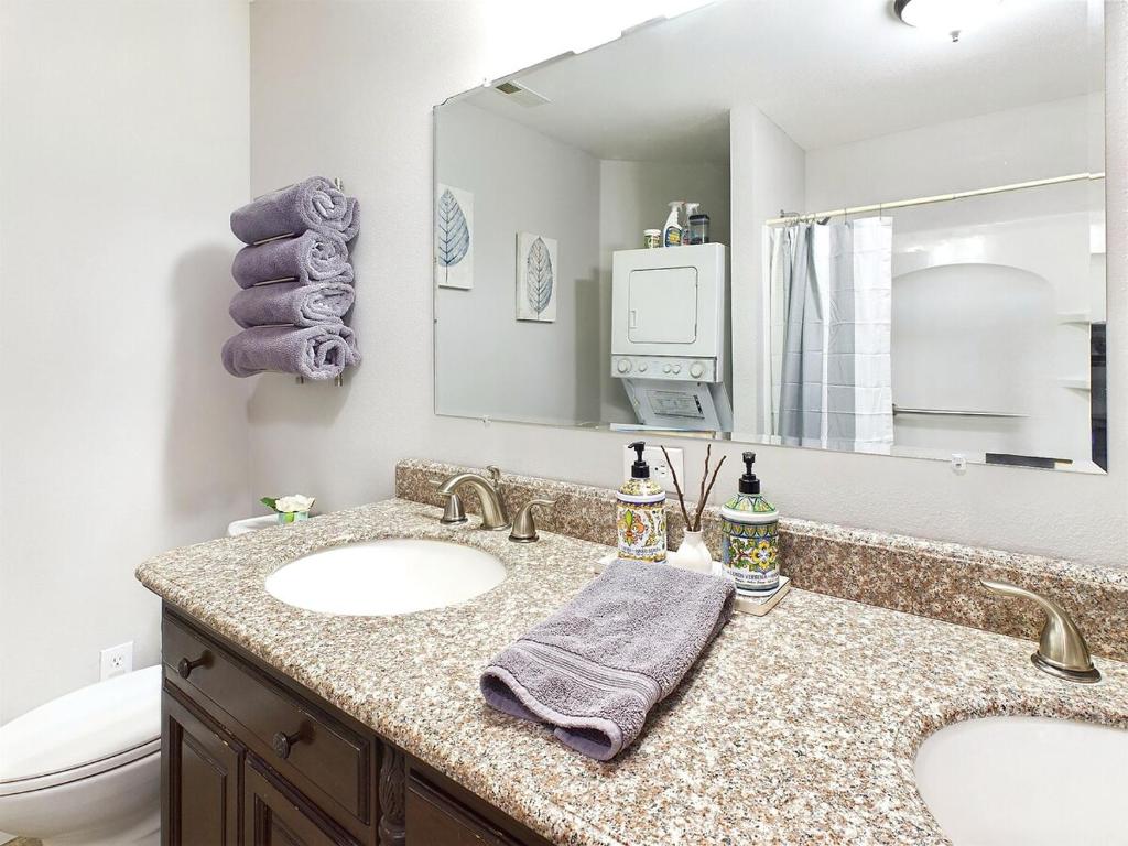 a bathroom with a sink and a mirror at 2 spaces More Space with 2 units at same location PNW Retreat in Philomath