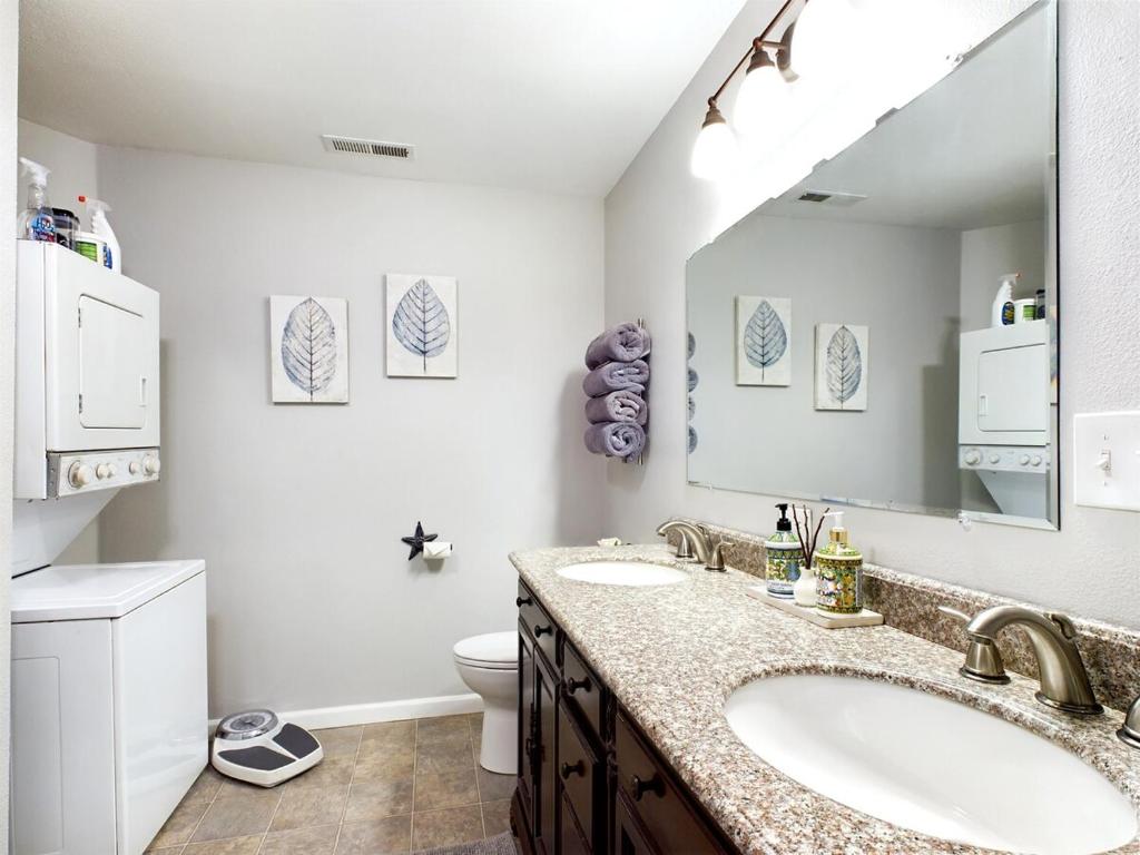 a bathroom with two sinks and a large mirror at 2 spaces More Space with 2 units at same location PNW Retreat in Philomath