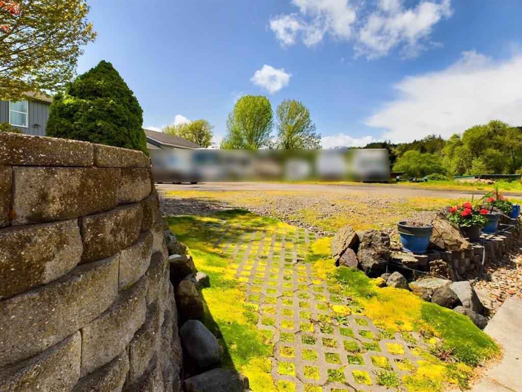a train is passing by a stone wall at 2 spaces More Space with 2 units at same location PNW Retreat in Philomath