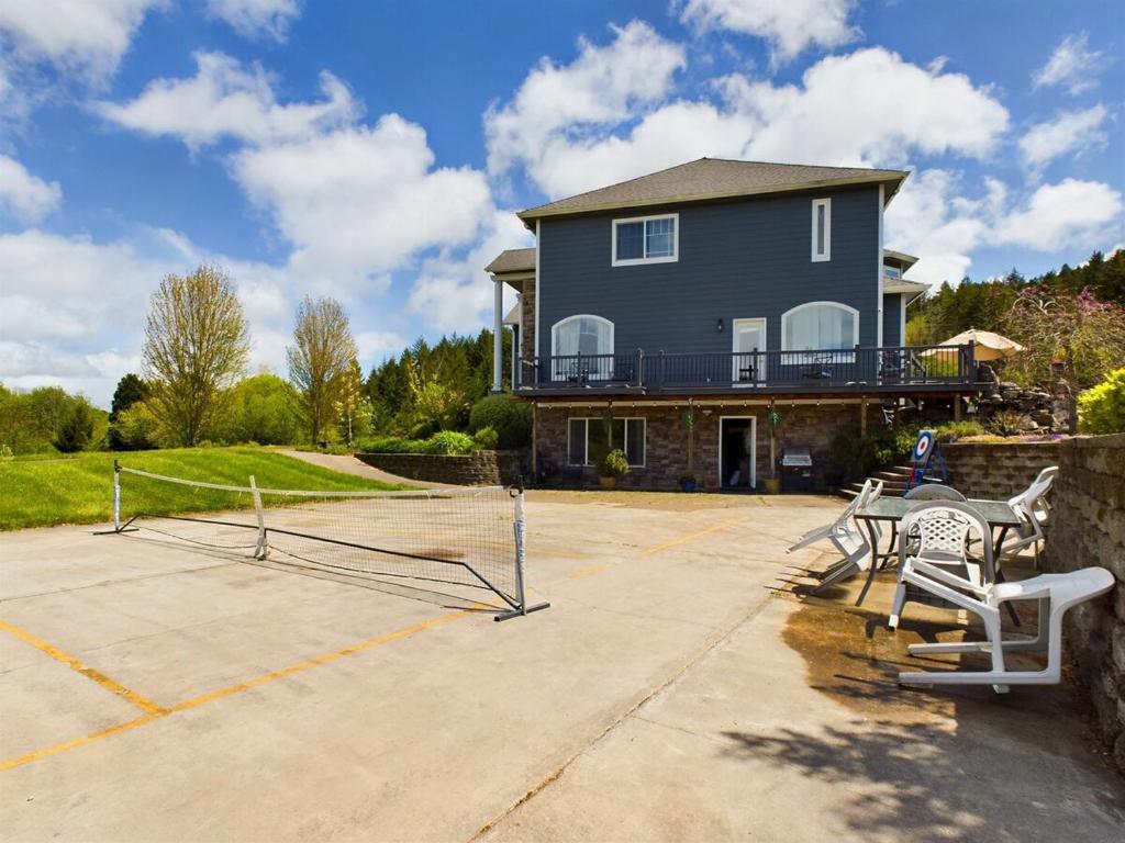 a large house with a patio and a house at 2 spaces More Space with 2 units at same location PNW Retreat in Philomath