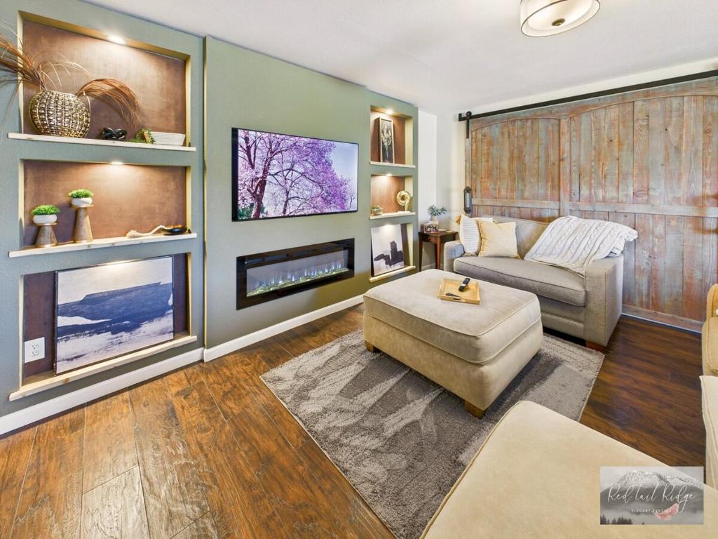 a living room with a couch and a fireplace at 2 spaces More Space with 2 units at same location PNW Retreat in Philomath