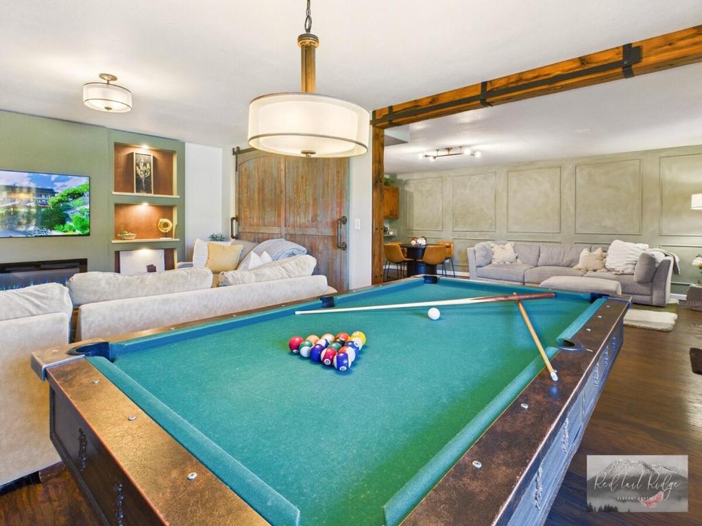 a living room with a pool table at 2 spaces More Space with 2 units at same location PNW Retreat in Philomath