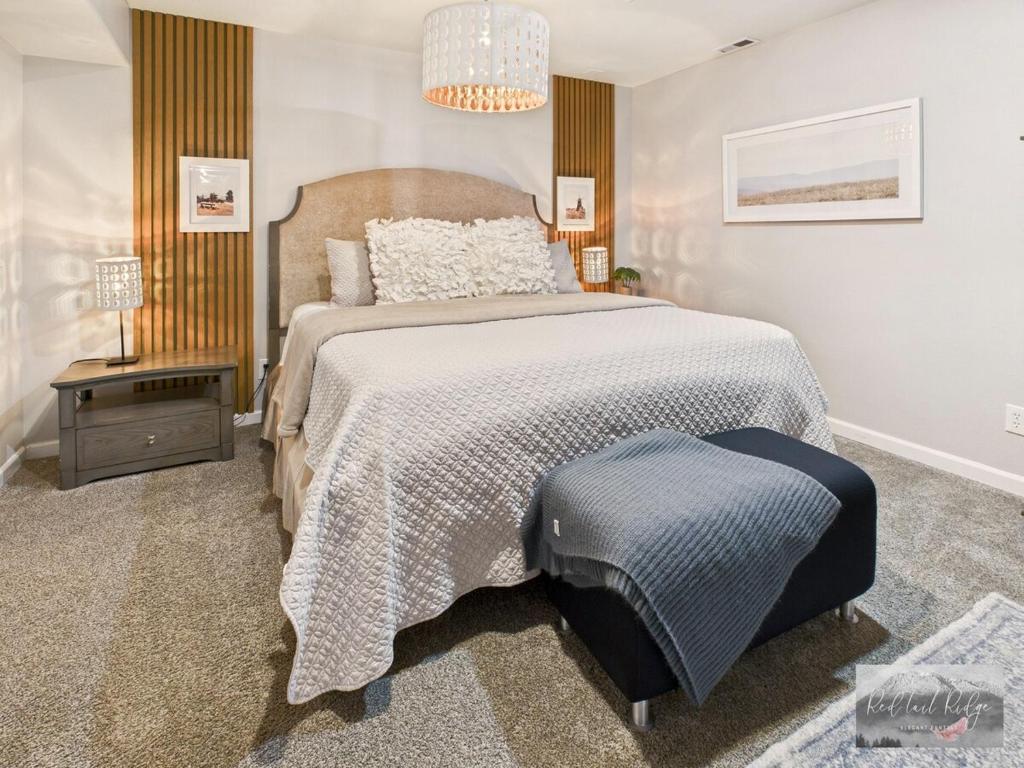a bedroom with a large bed and a table at 2 spaces More Space with 2 units at same location PNW Retreat in Philomath