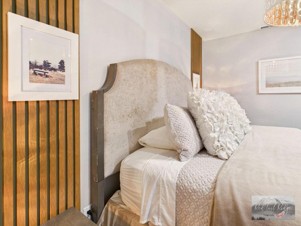 a bedroom with a bed with white sheets and pillows at 2 spaces More Space with 2 units at same location PNW Retreat in Philomath