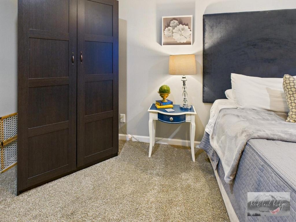 a bedroom with a bed and a dresser and a cabinet at 2 spaces More Space with 2 units at same location PNW Retreat in Philomath