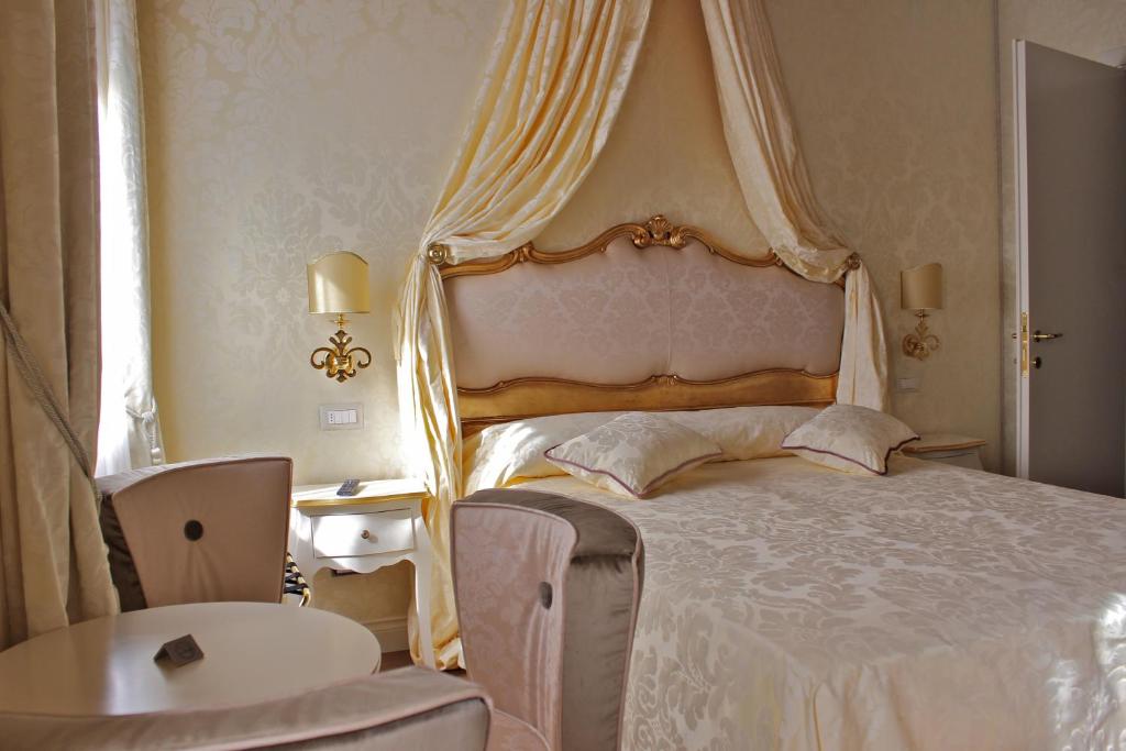 Postel nebo postele na pokoji v ubytování B&B Patatina