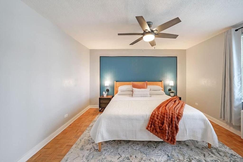 a bedroom with a bed with a ceiling fan at Prime Downtown Atlanta Condo with Balcony in Atlanta