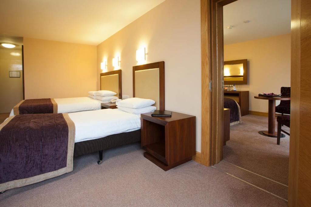 Postel nebo postele na pokoji v ubytování Westport Woods Hotel & Spa