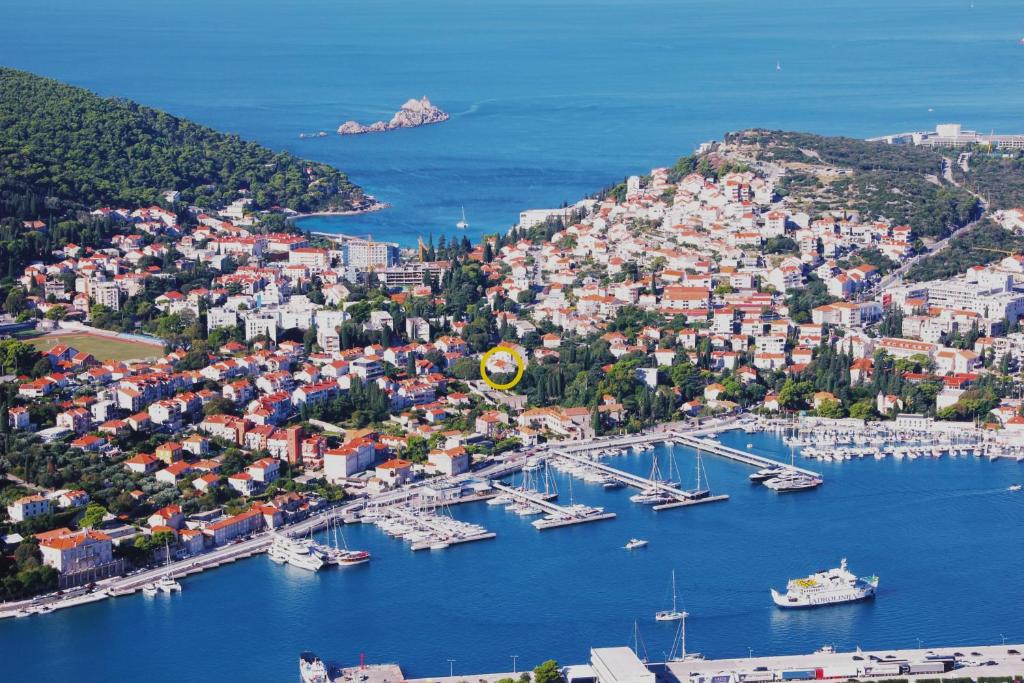 an aerial view of a harbor with boats in the water at Apartments Artemis Dubrovnik in Dubrovnik