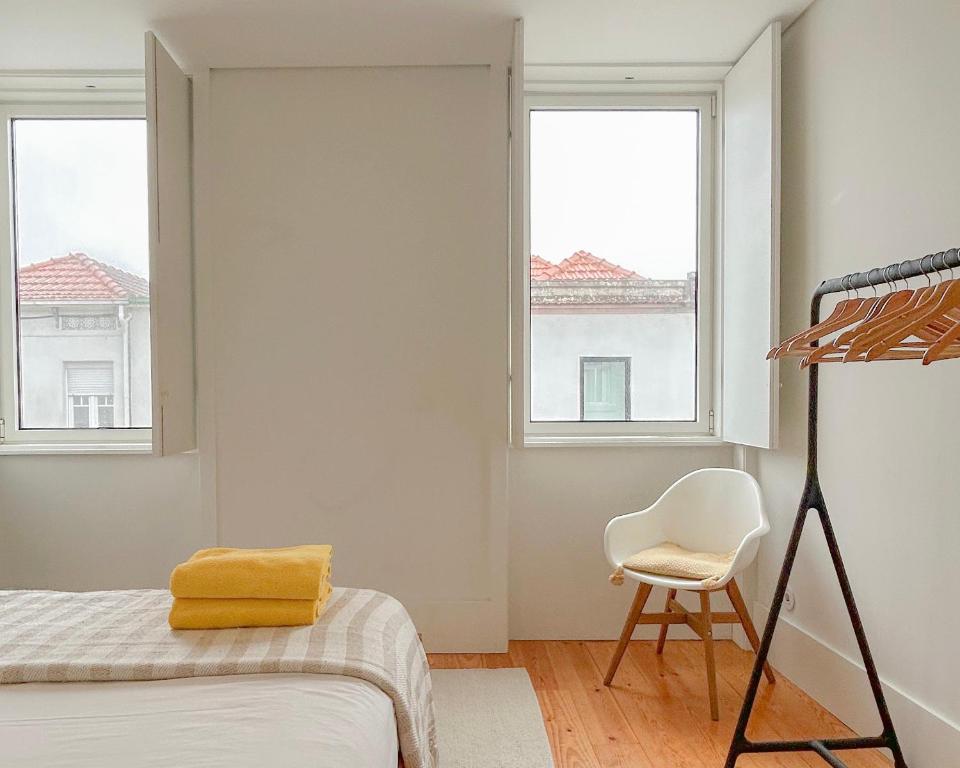 Postel nebo postele na pokoji v ubytování Guest House Arca de Água