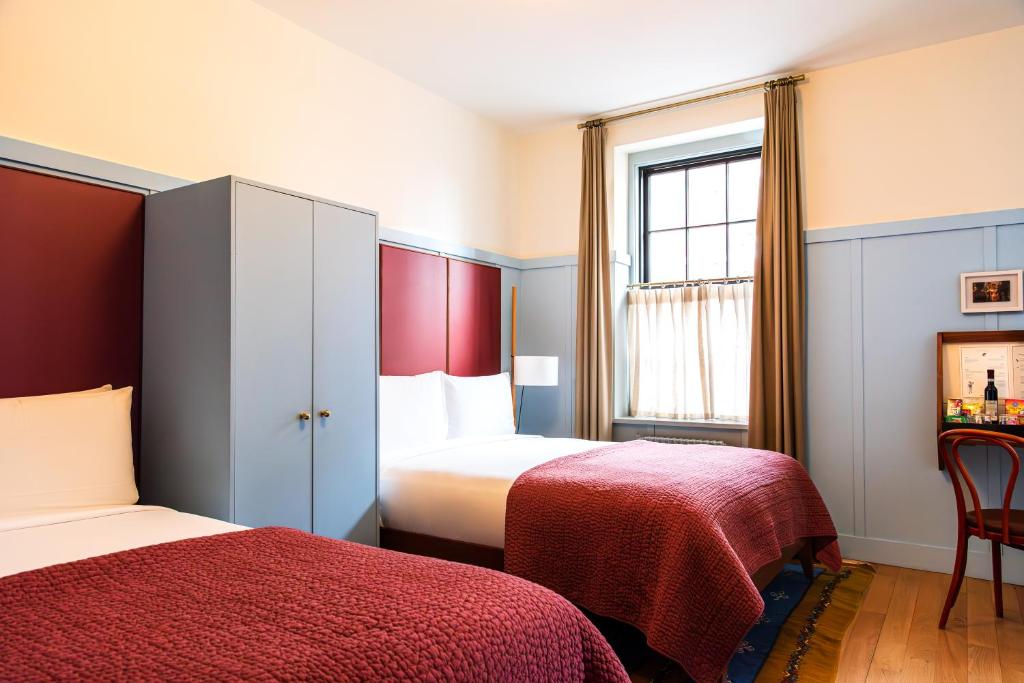 Postel nebo postele na pokoji v ubytování Hotel Kinsley