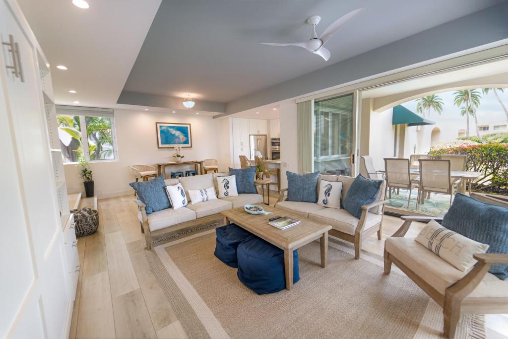 a living room with a couch and a table at Wailea Hidden Gem in Wailea