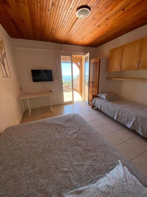 Postel nebo postele na pokoji v ubytování Le Surplage