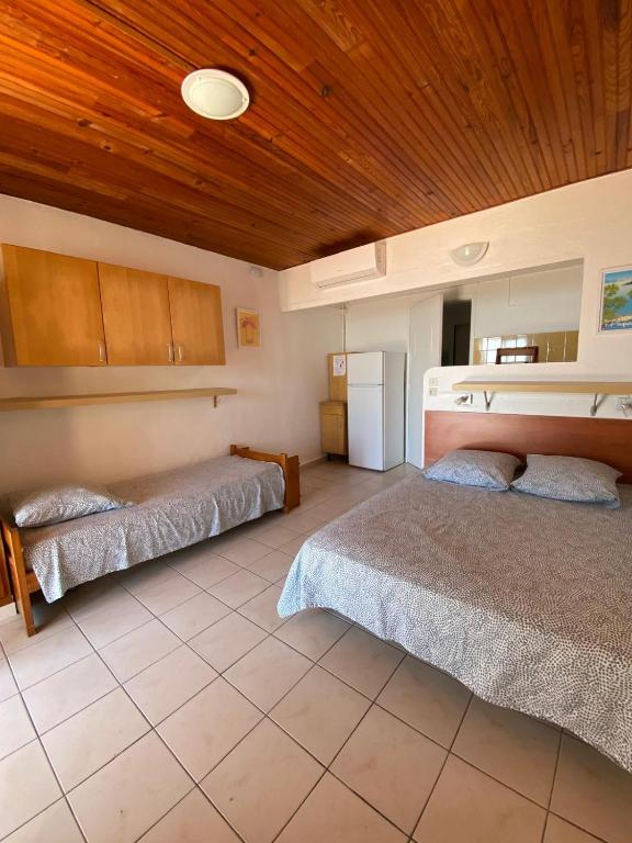 Postel nebo postele na pokoji v ubytování Le Surplage