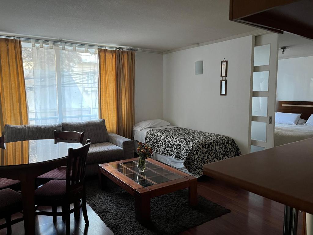 Postel nebo postele na pokoji v ubytování Chilhotel en Providencia