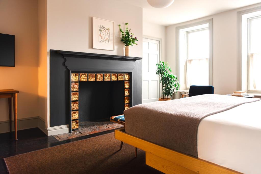 Postel nebo postele na pokoji v ubytování Hotel Kinsley