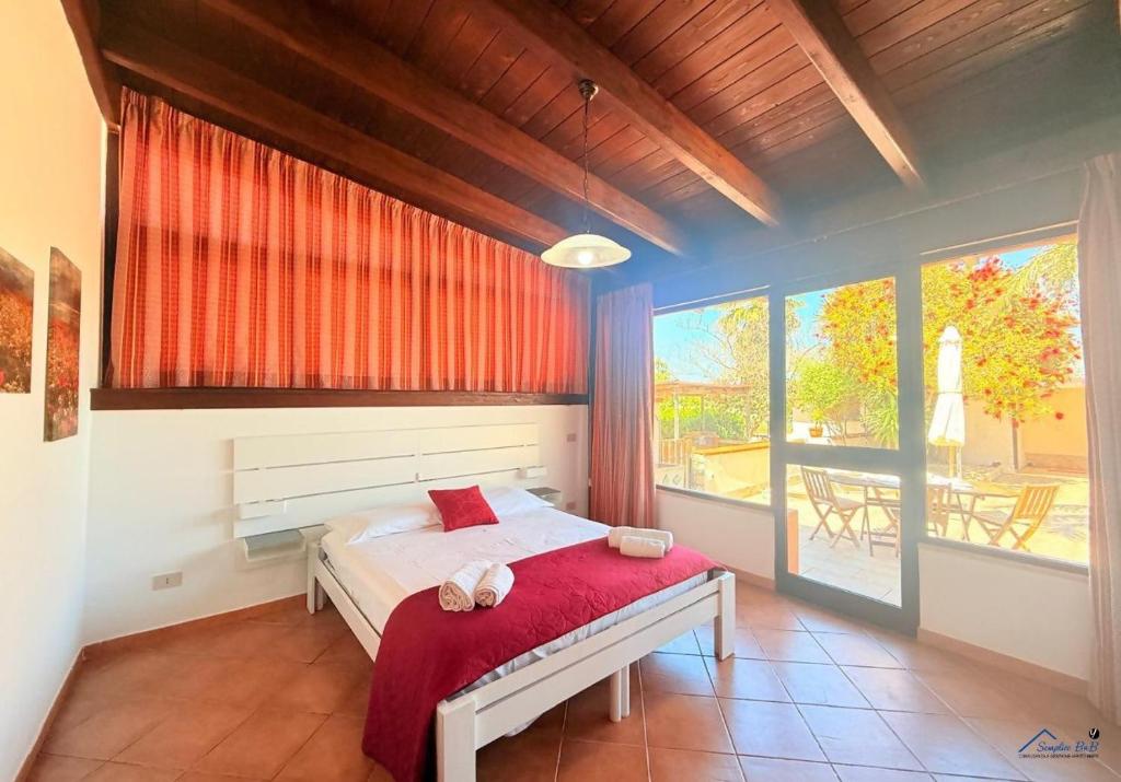 Postel nebo postele na pokoji v ubytování Villa Andrea "Vivi l'Oasi di Tranquillità"
