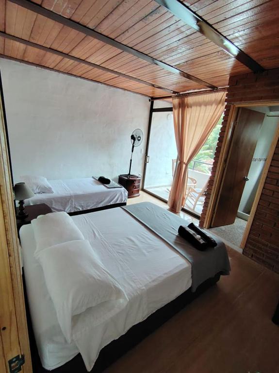 Postel nebo postele na pokoji v ubytování Eco Hotel Entre Ríos