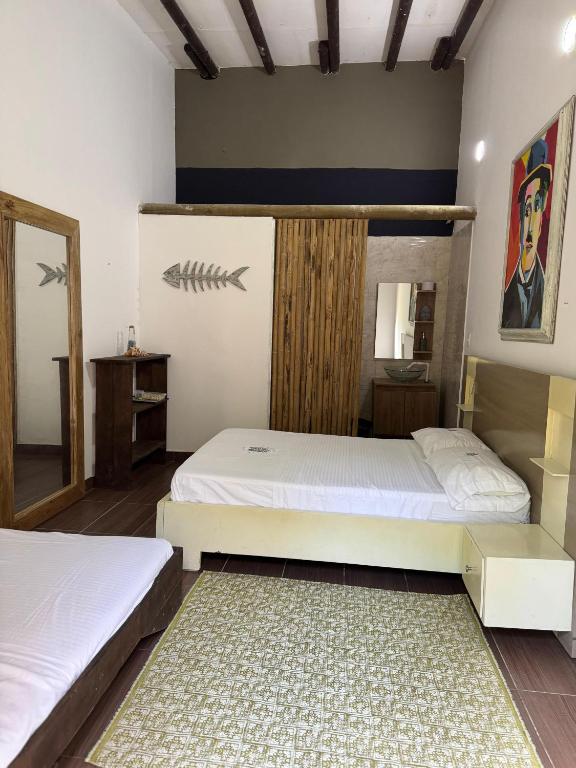 Postel nebo postele na pokoji v ubytování Medusa Hostel Isla Tintipan